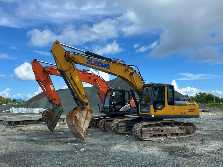 Two 20-tonne tracked excavators on an island laydown area
